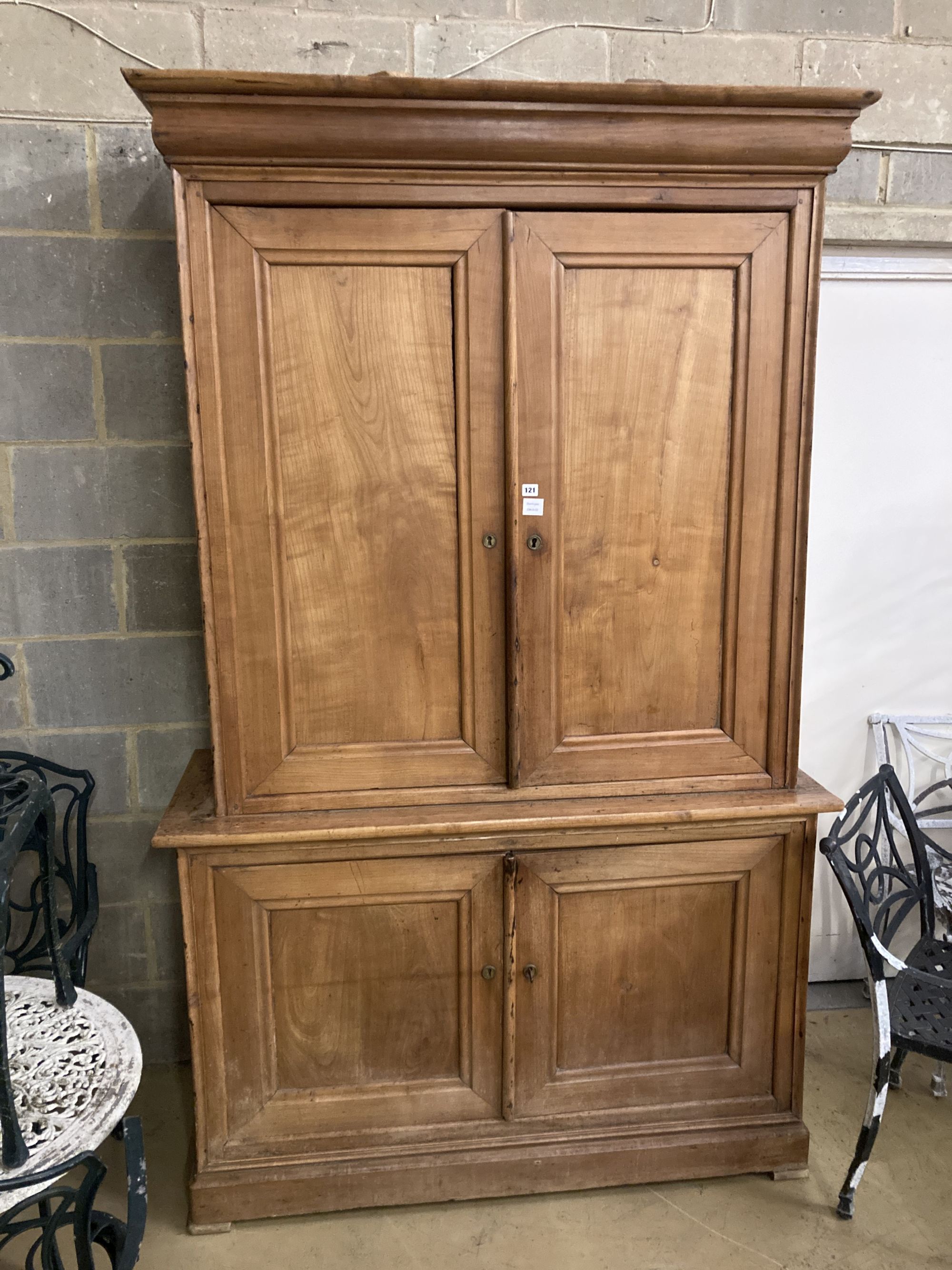 An early 19th century French cherry four door buffet, length 138cm, depth 54cm, height 226cm